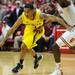 Michigan sophomore Trey Burke moves the ball around Indiana defense during the second half at Assembly Hall on Saturday, Feb. 2 in Bloomington, Ind. Melanie Maxwell I AnnArbor.com